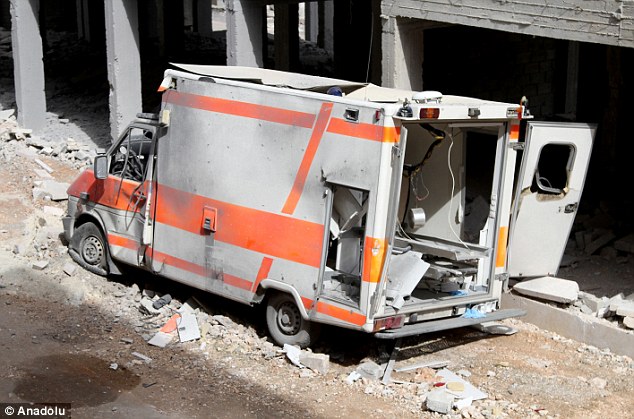 Horror: A ruined ambulance is seen after airstrikes on the Qabtan al Jabal town of Aleppo, Syria, in February